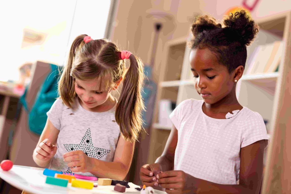 Children playing with playdough. 