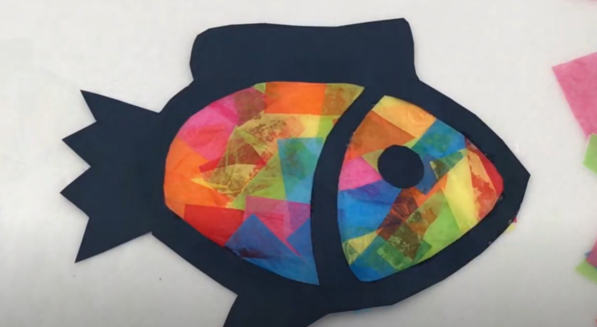 The completed fish suncatcher made from construction paper and tissue paper. 