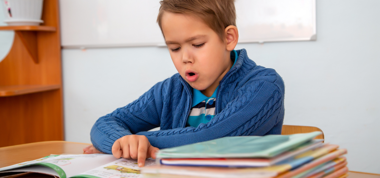 Boy reading a book. 