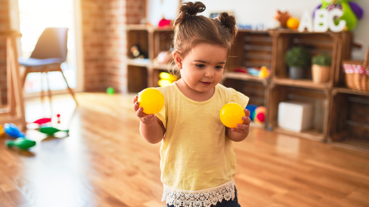 Small child playing catch. 