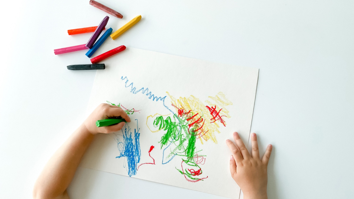 Child coloring a picture. 