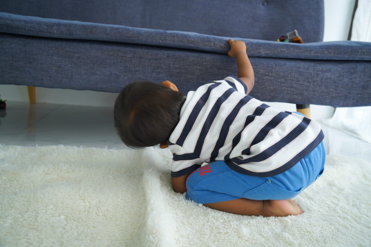 Child looking for letters hidden. 