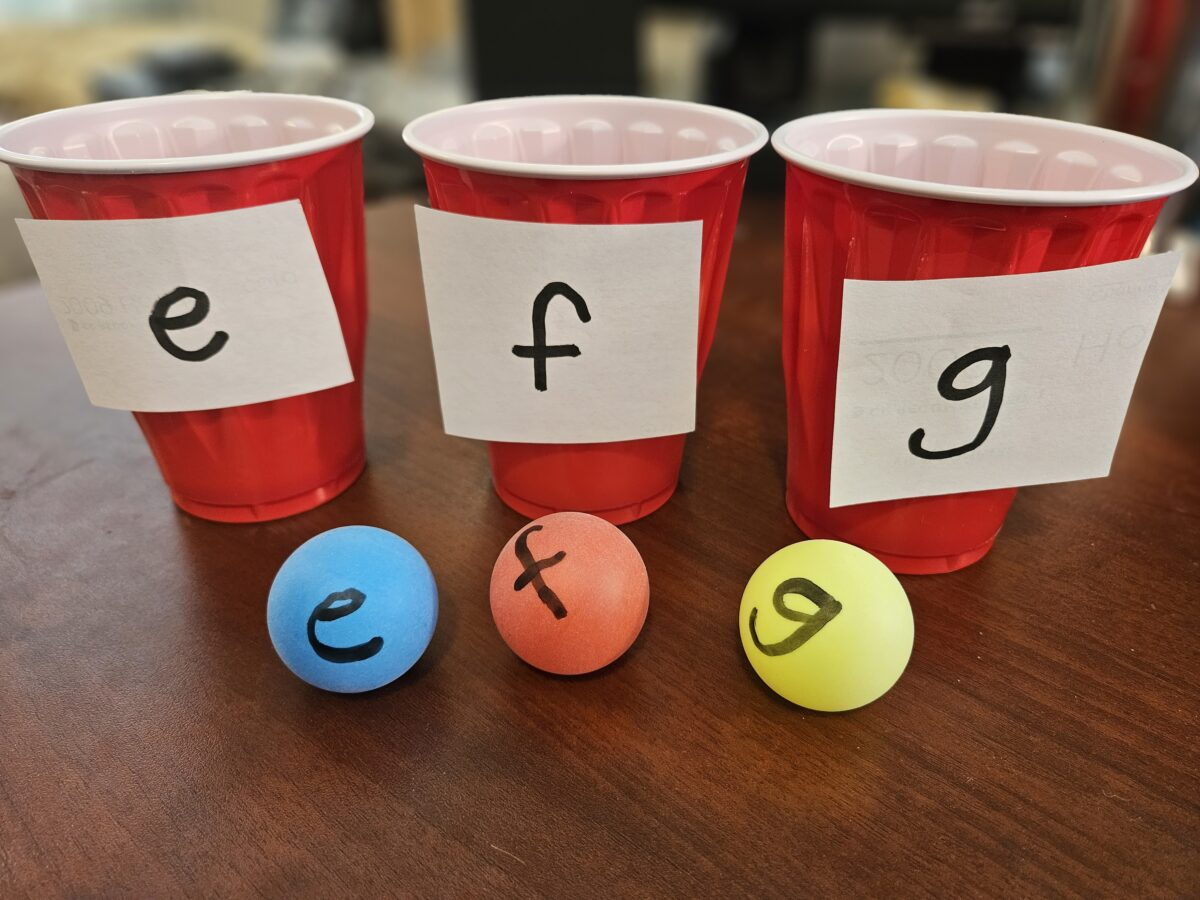 Ping Pong balls with cups. 