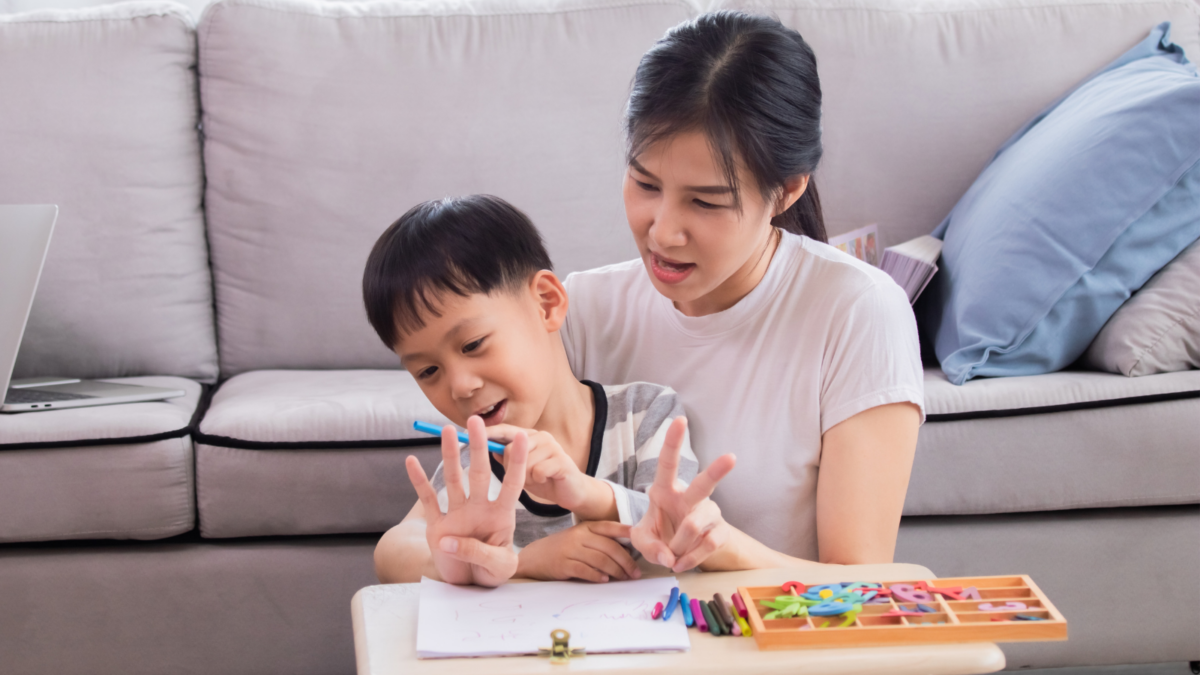 A mother and child counting and learning numbers together. 