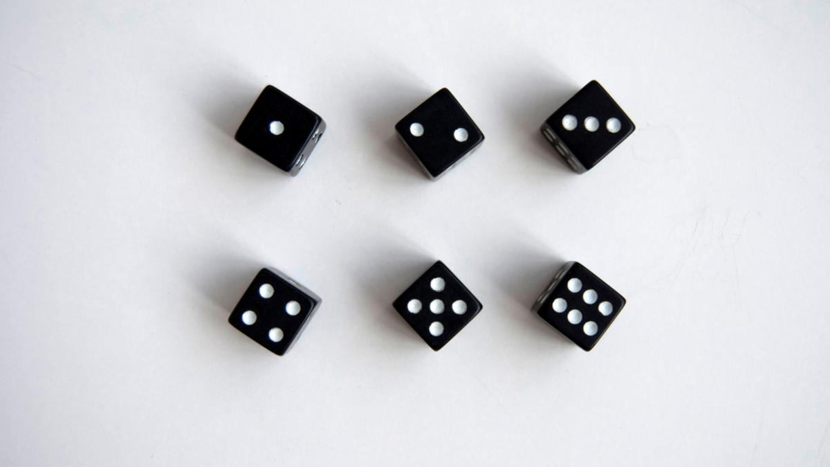 Six dice showing all six sides of the dice. 