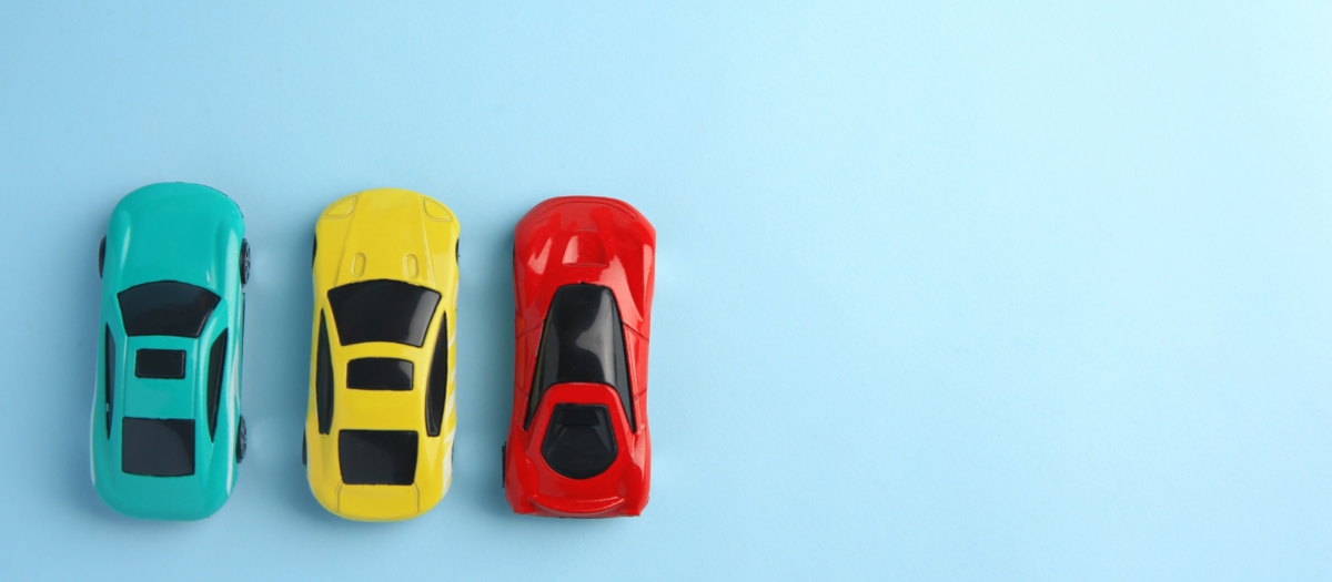 Toy Cars on a blue background. 