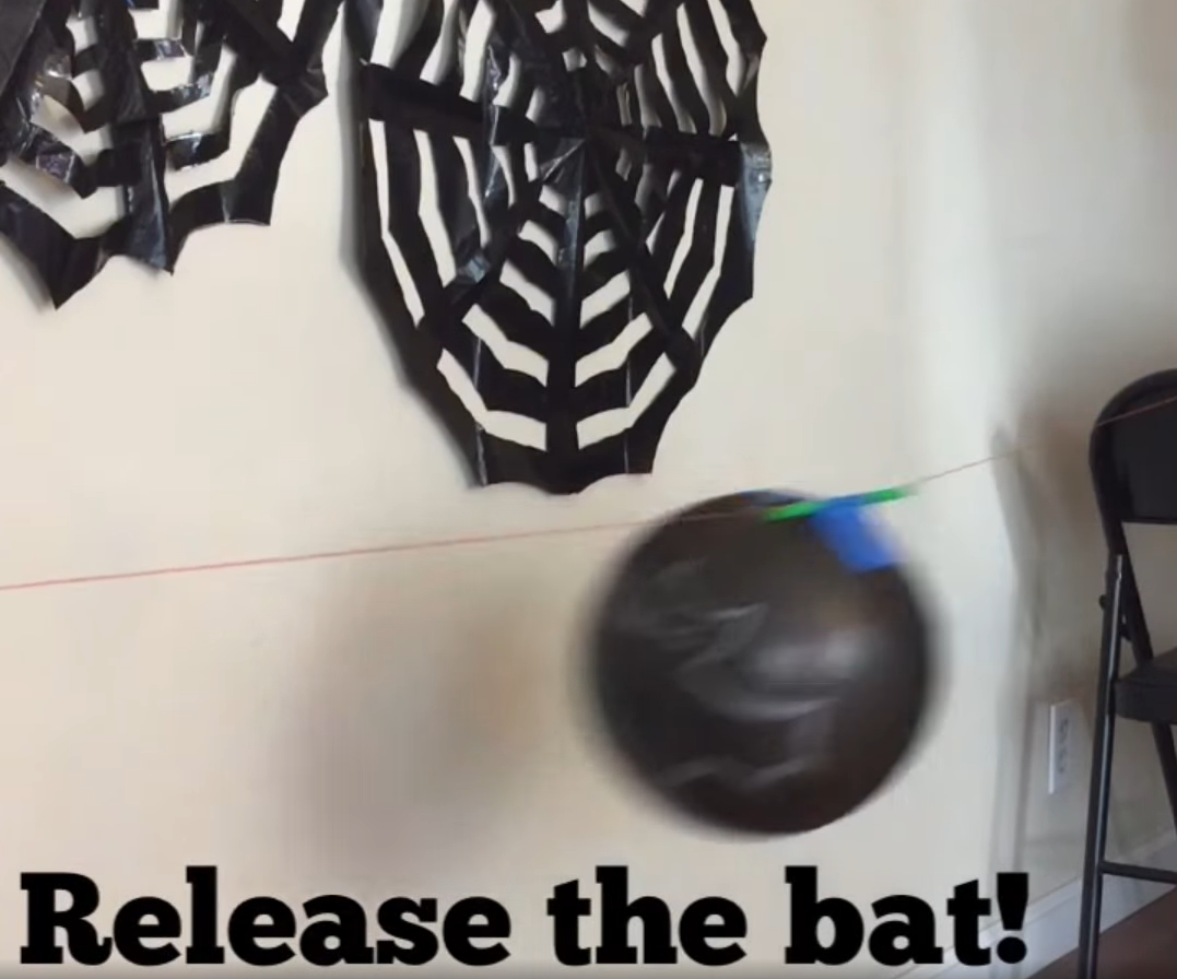 Testing out the fun Halloween bat balloon activity. 