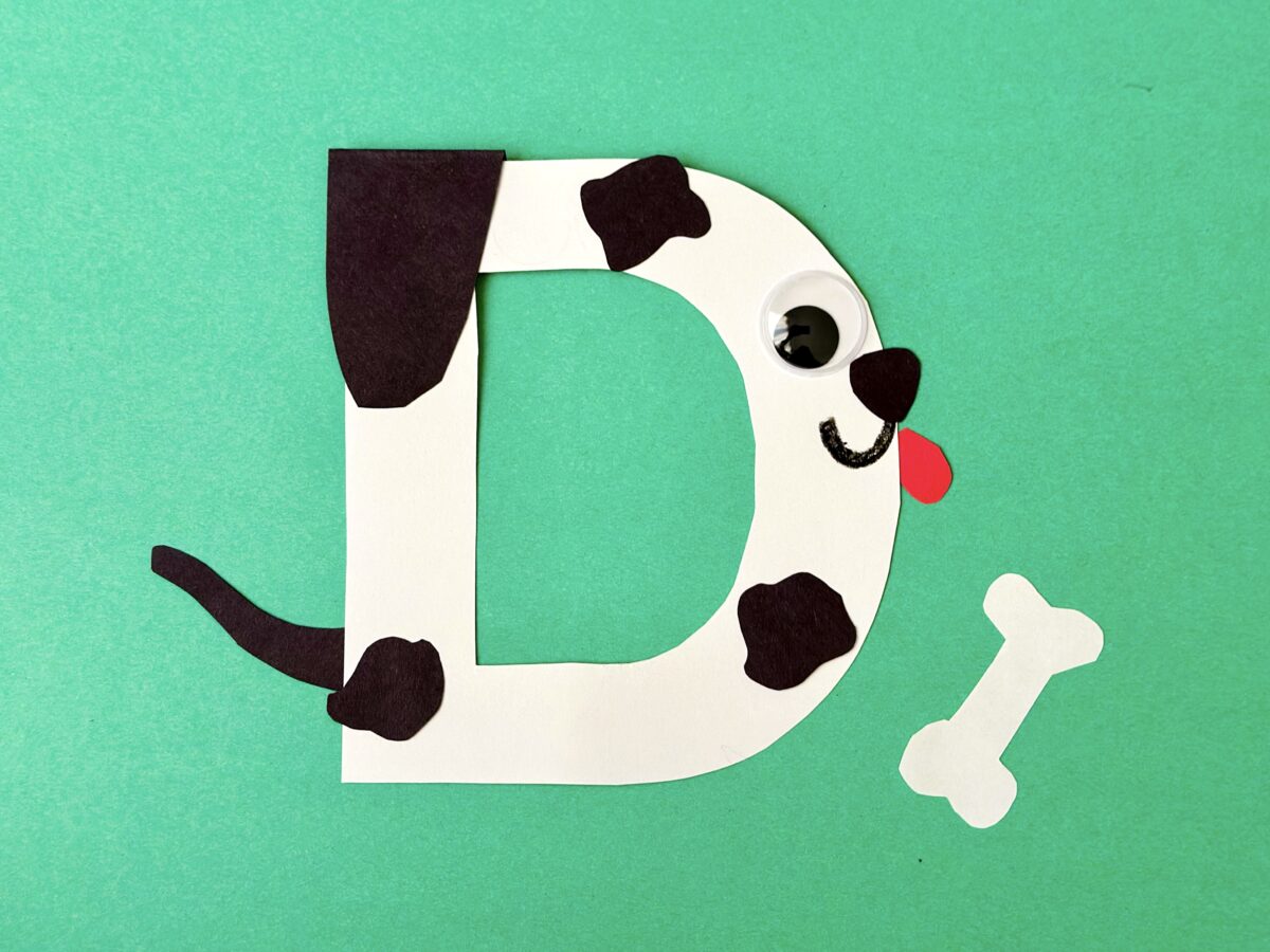 Letter D in the shape of a Dalmatian dog. 