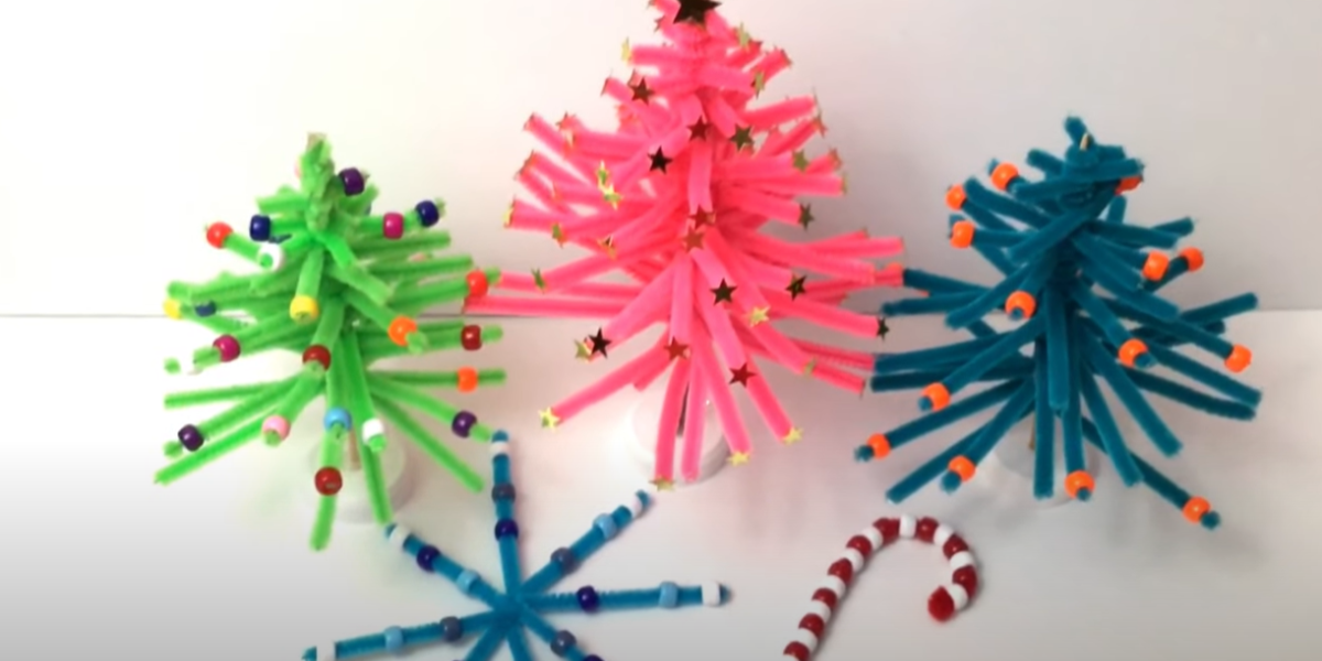 Colorful pipe cleaner Christmas tree crafts with a s snow flake and candy cane. 