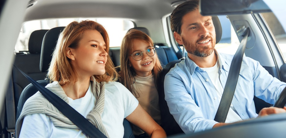 Family in the car playing a game together. 