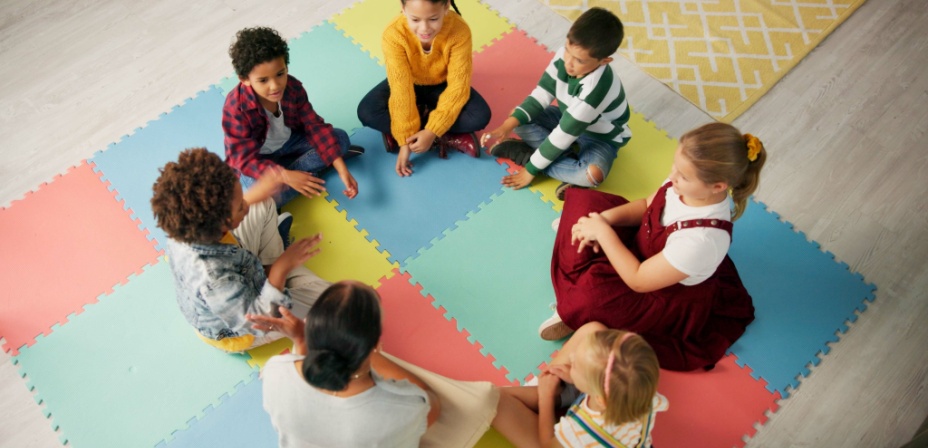 Children sitting in a circle. 