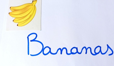 The word bananas in cursive with a picture of a bunch of bananas. 