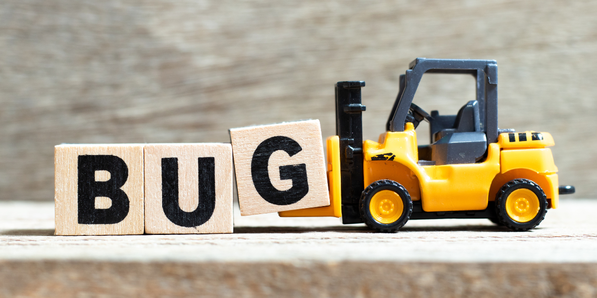 A toy fork lift holding up a wooden letter g block that is in the end of a string of blocks that spell the word bug.