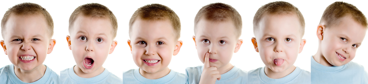 A young boy making lots of different silly faces. 