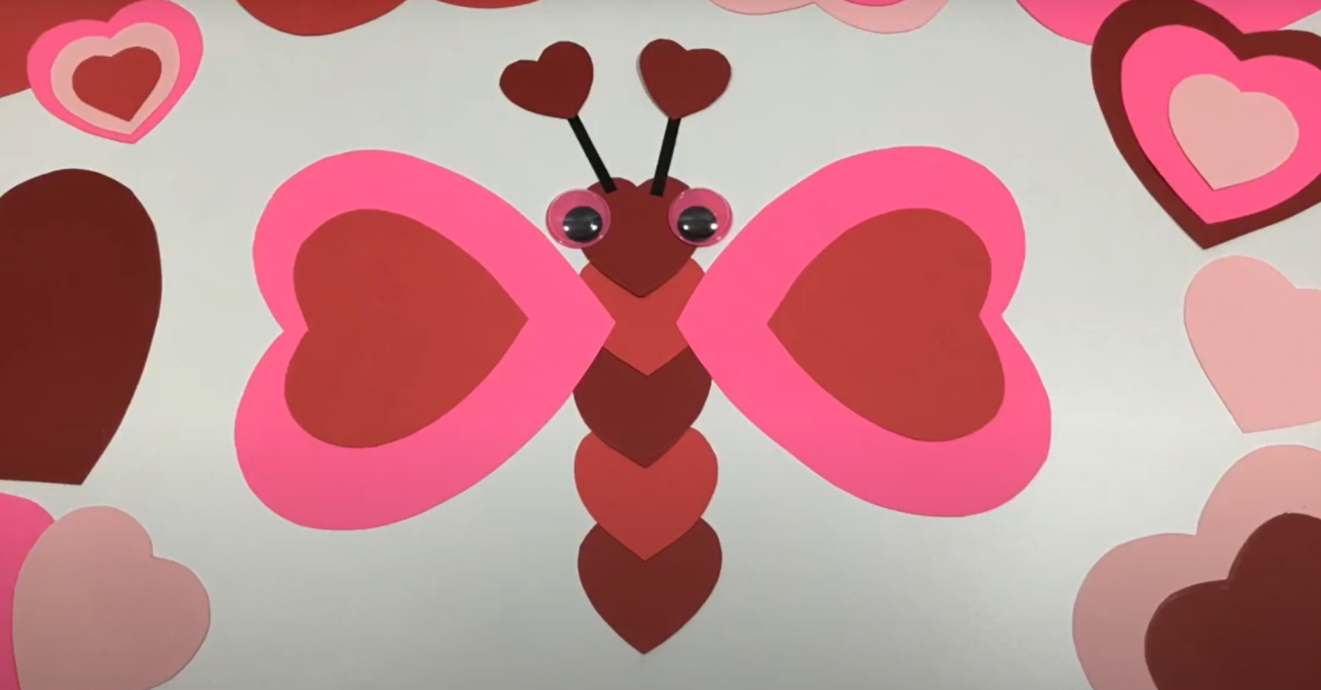 A cute valentines day butterfly craft made from cut paper hearts. 