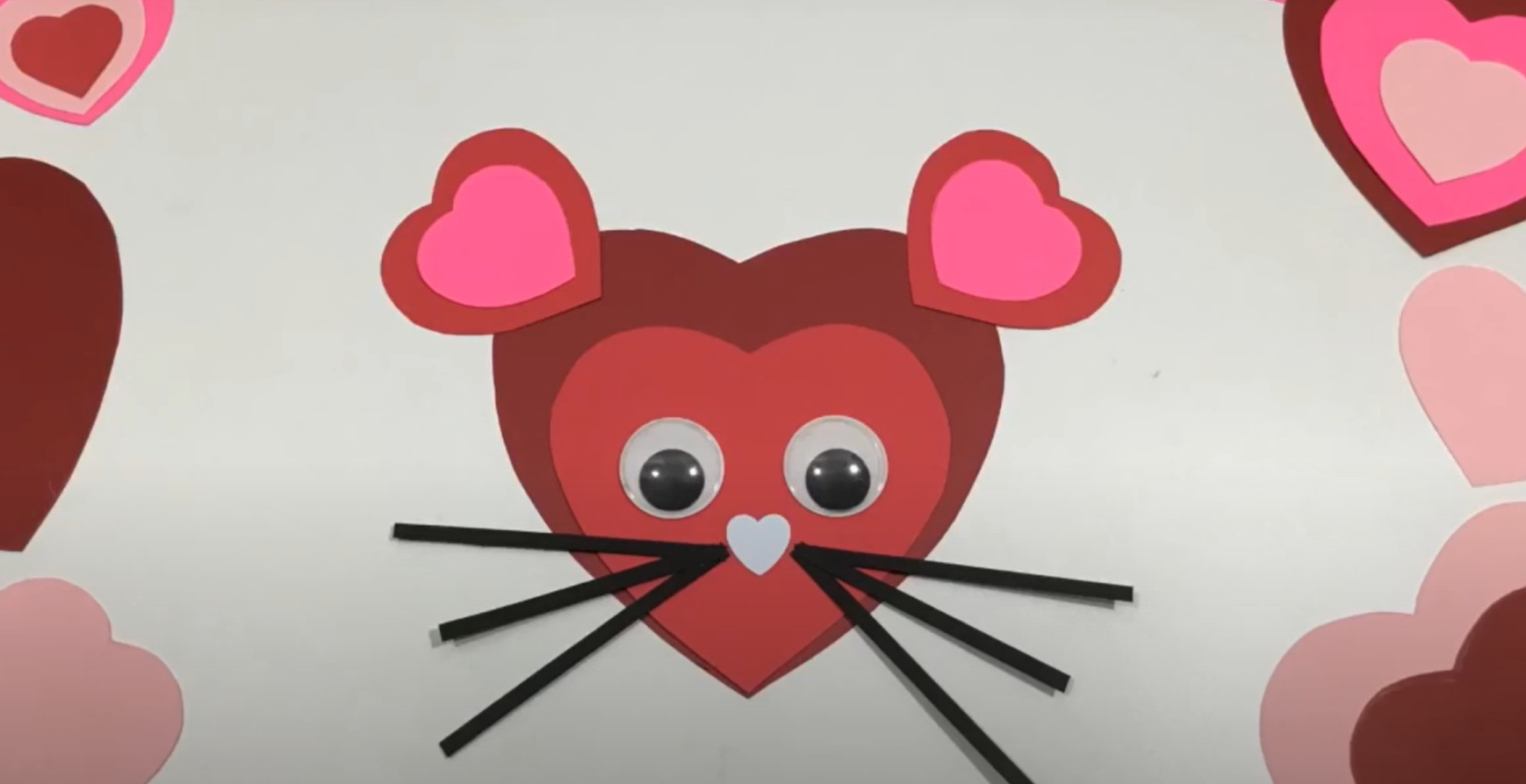 A cute valentines day mouse craft made from cut paper hearts. 