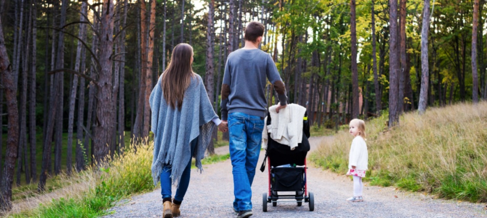 A young family on a nature walk. 